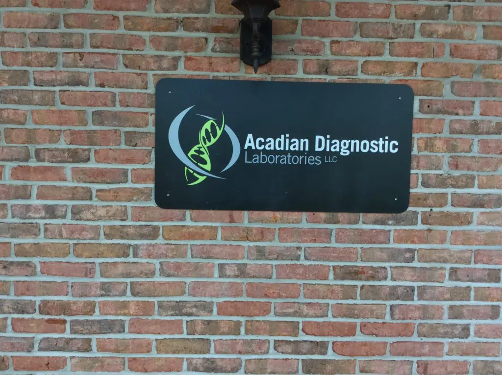 Custom-made aluminum decals for indoor or outdoor use, rust-free and durable, perfect for business or building signage. Acadian Diagnostic laboratories llc